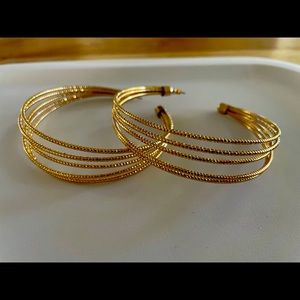 Gorgeous large gold colored hoop earrings